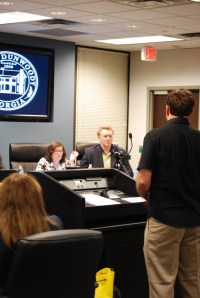 A representative of Treetop Quest, LLC addresses Dunwoody council members Lynn Deutsch and John Heneghan. Photo by Lauren Ramsdell.